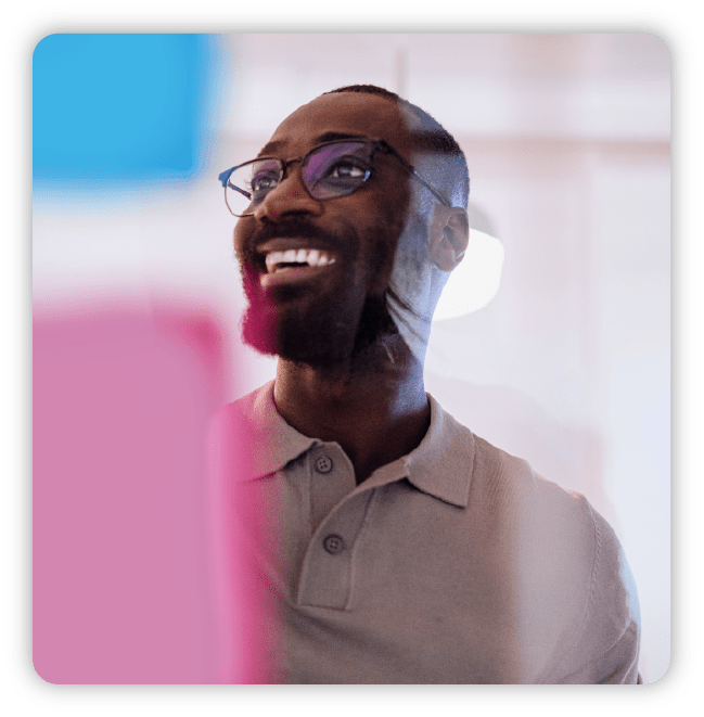 Smiling man wearing polo shirt with glasses