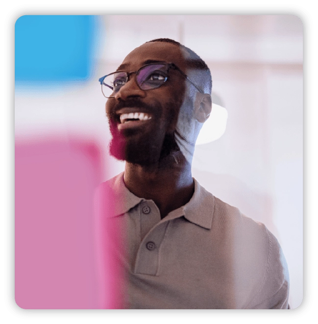 Smiling man wearing polo shirt with glasses
