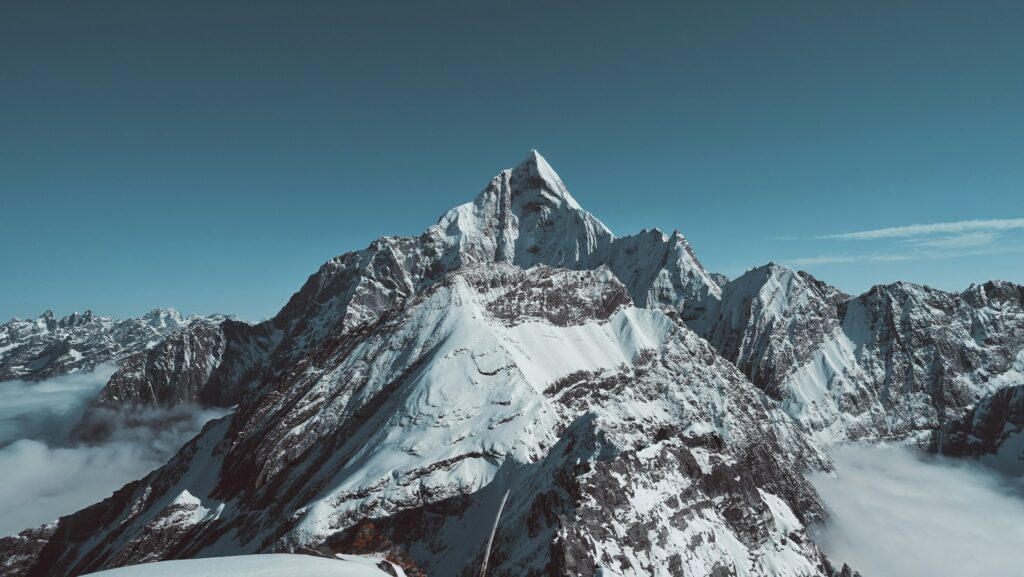 Trade Surveillance banner | Rocky, mountain range covered in snow