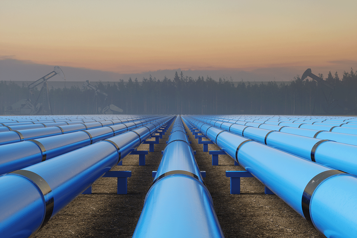 Rows of blue pipes lined up at sunset