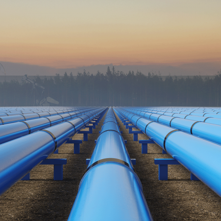 Rows of blue pipes lined up at sunset